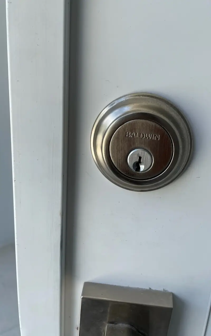 baldwin-deadbolt-batesville-locksmith-door-lock Batesville locksmith servicing Baldwin deadbolt on residential door