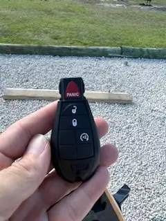 What Does a Lockout Cost in Batesville AR? Real Prices and Response Times for 2026 1 Dodge fobik key held during a car lockout cost service call near Batesville Arkansas