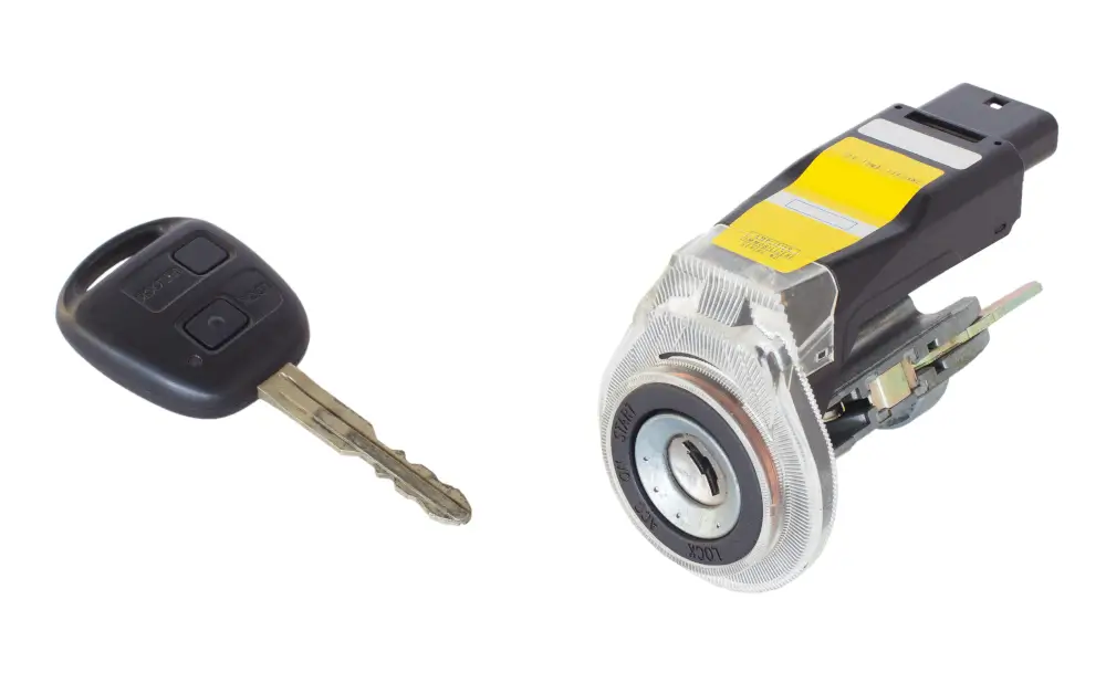 Ignition Cylinder Problems in Pine Bluff AR: Why Your Key Will Not Turn 1 Car key beside a removed ignition lock cylinder assembly with immobilizer ring